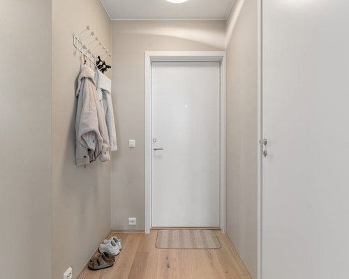 Comfortable daily footwear neatly aligned near a clean minimalist entrance hallway floor